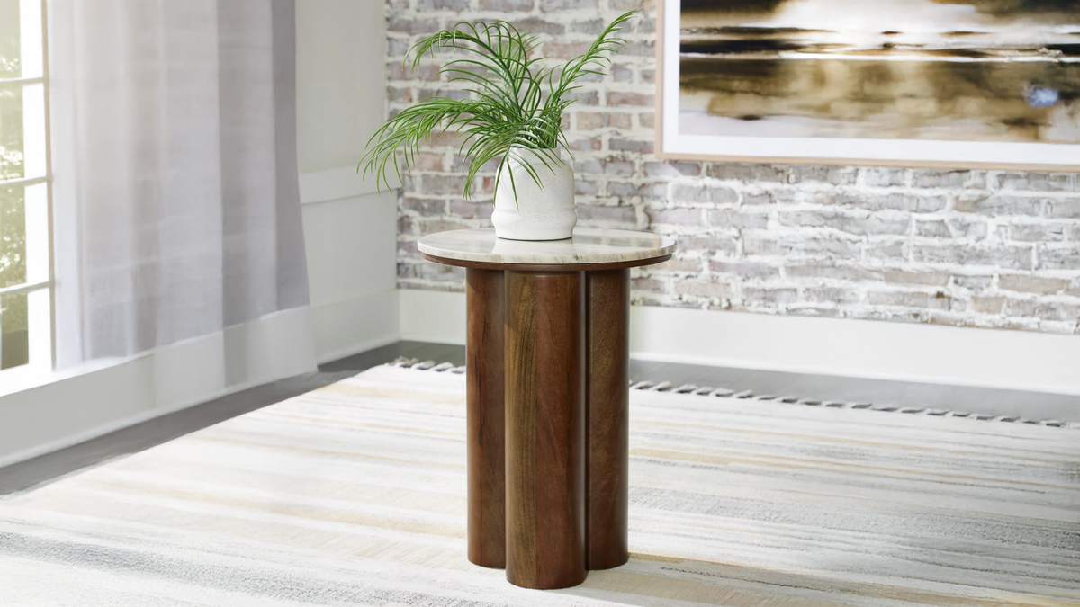 Wooden side table with a plant in a modern interior setting
