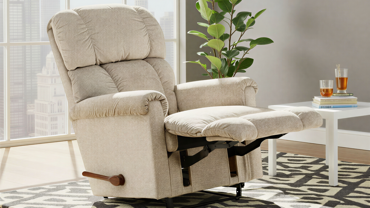 Beige recliner chair in a living room setting with a plant and small table.