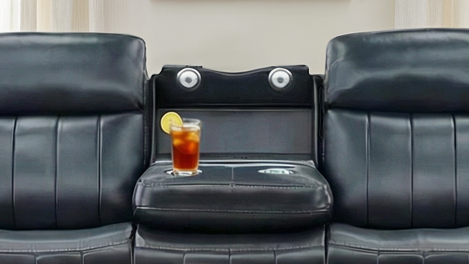 Black leather lounge seat with a drink on a tray