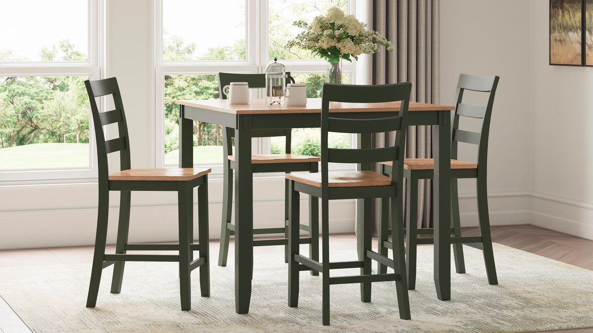 Dining room with a wooden table and chairs near a window.