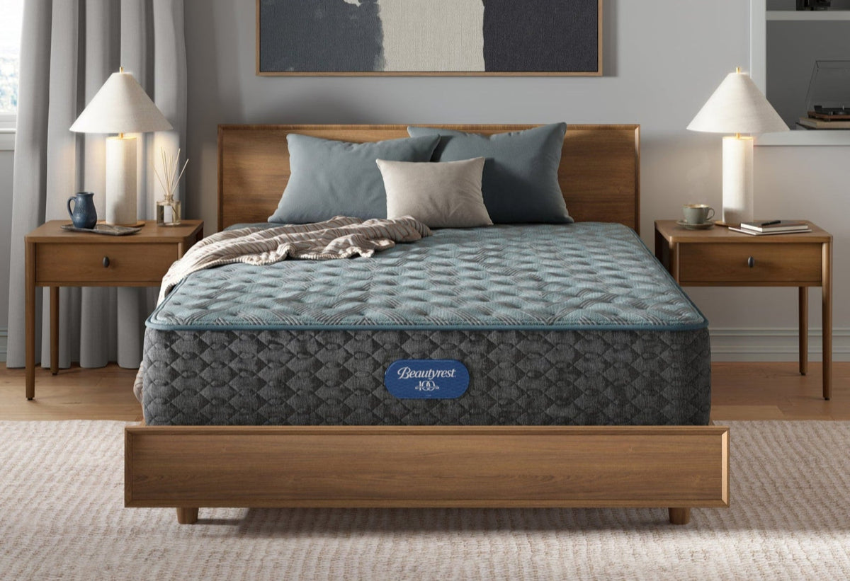 Beautyrest Luxury Resort II - Firm grey mattress on wood bed frame in a bedroom setting
